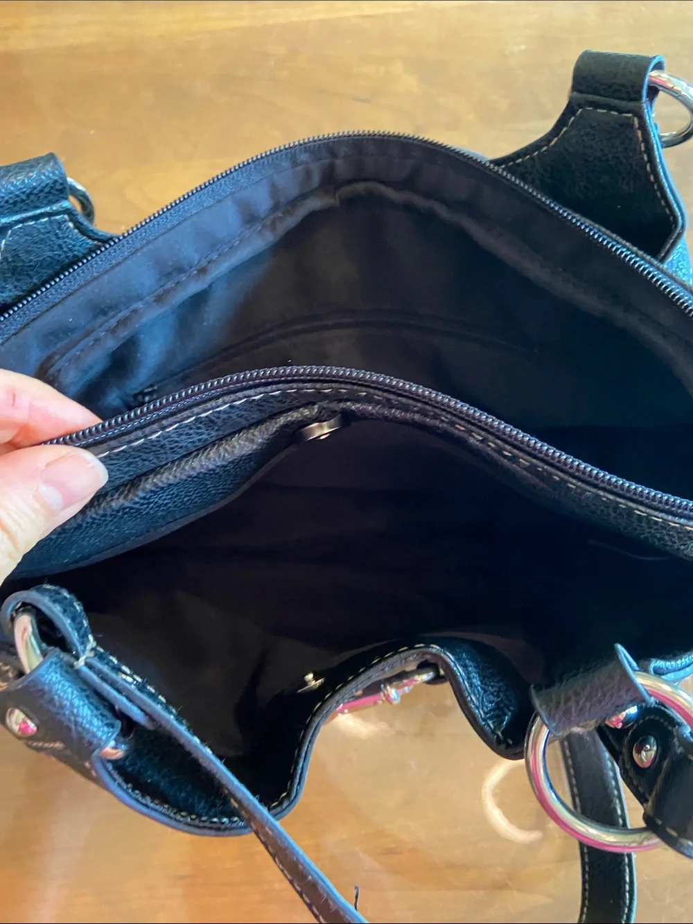 Black Women's Vinyl Handbag with Silver Hardware. Three sections for organizing